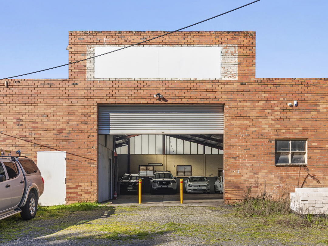 A modern freestanding commercial warehouse and office building